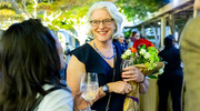 Dr. Matulevicius converses with another guest while enjoying the reception.