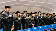 Doctor of Physical Therapy graduates recite the Pledge of Allegiance.