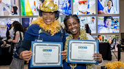 Earning a Gold pin is a reason to celebrate in style for recipients Fatmata Barry with the Outpatient Surgical Center, left, and Krystal Carson from the Post-Anesthesia Care Unit, at the Health System Affairs event.