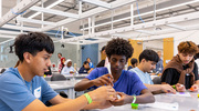 After shaping a mold with Play-Doh, Harmony Science Academy students Pablo Badillo, left, and Mr. Mitike fill it with denatured collagen, which is the most prevalent structural protein in human bodies and is frequently used in tissue engineering.
