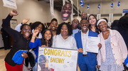Ayomide Osunjimi, all smiles holding his Match letter, celebrates with enthusiastic family and friends.