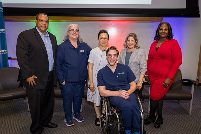Group of six people, one seated in a wheelchair.