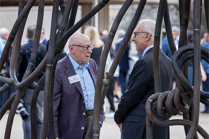 Two men chatting.