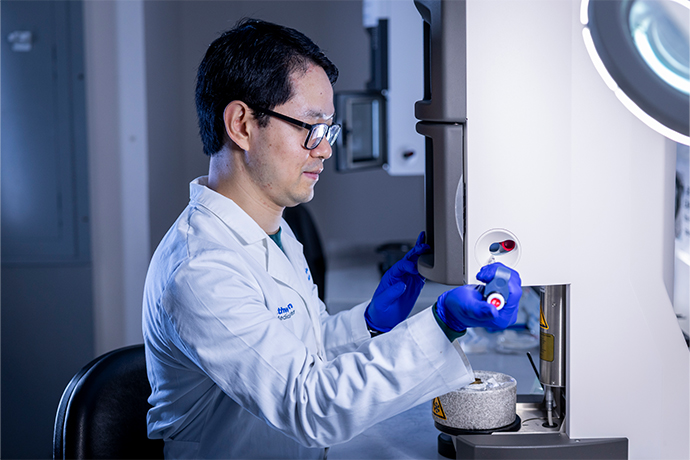 Scientist working with lab equipment.
