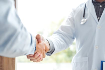 two doctors shaking hands