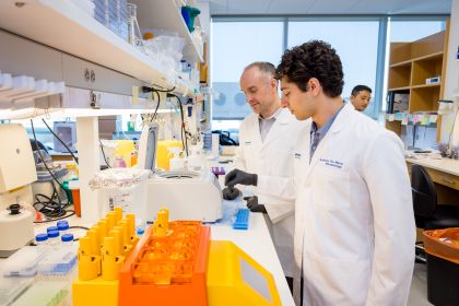 student and instructor working in a lab