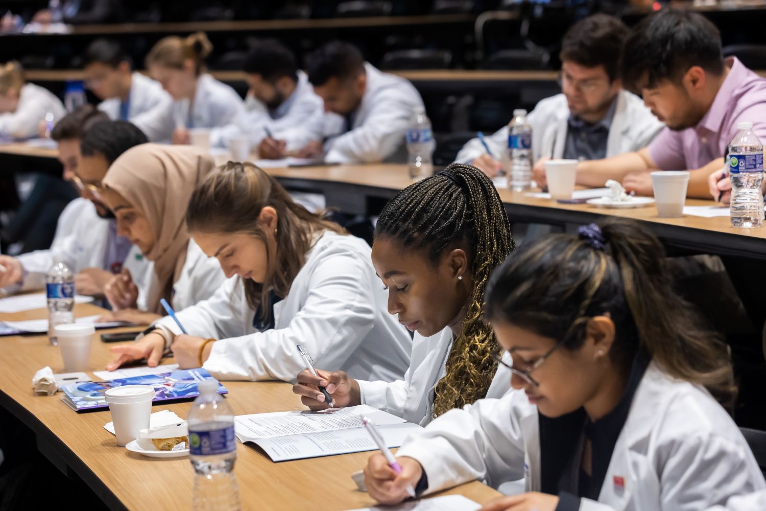 medical students writing in classroom