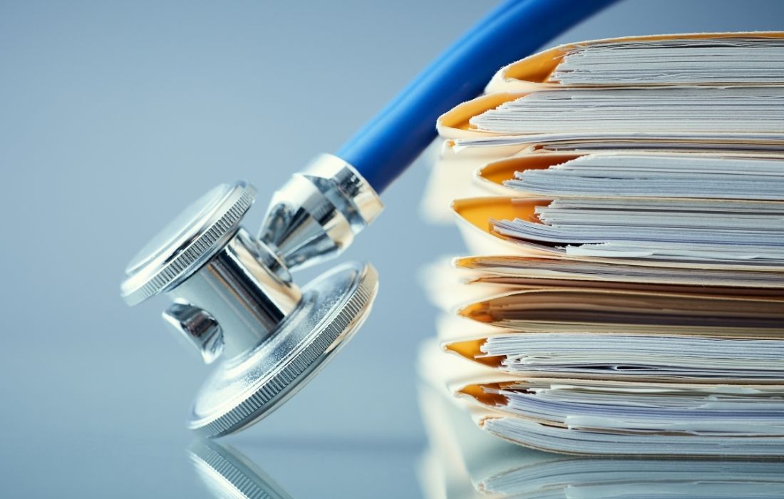 stethoscope and stack of books