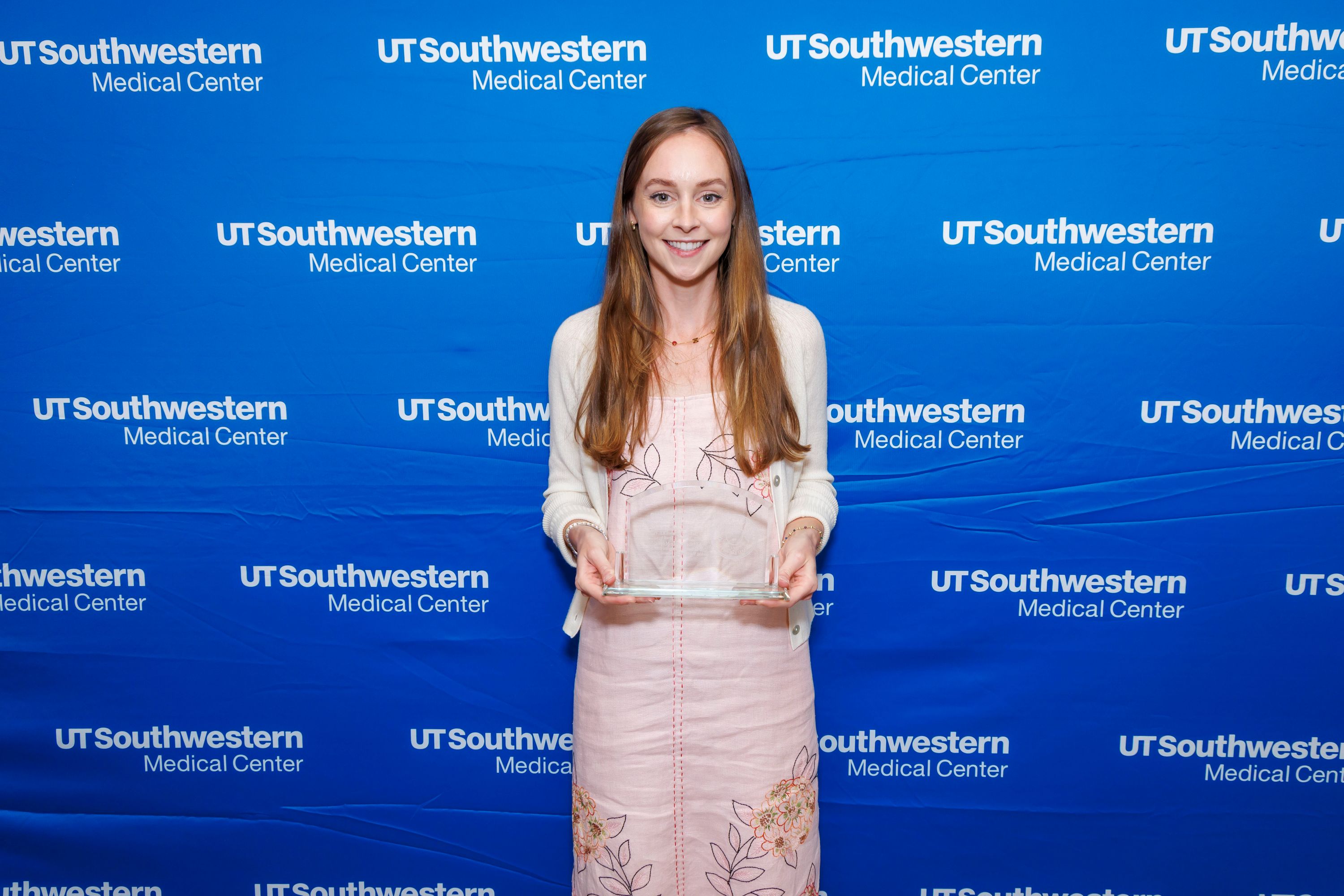 QAllison Mootz, M.D., holding Award