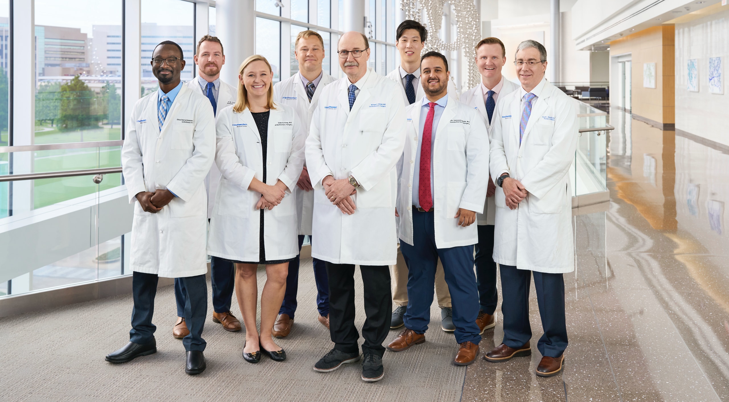 a group of five Cardiothoracic Fellows in their white coats