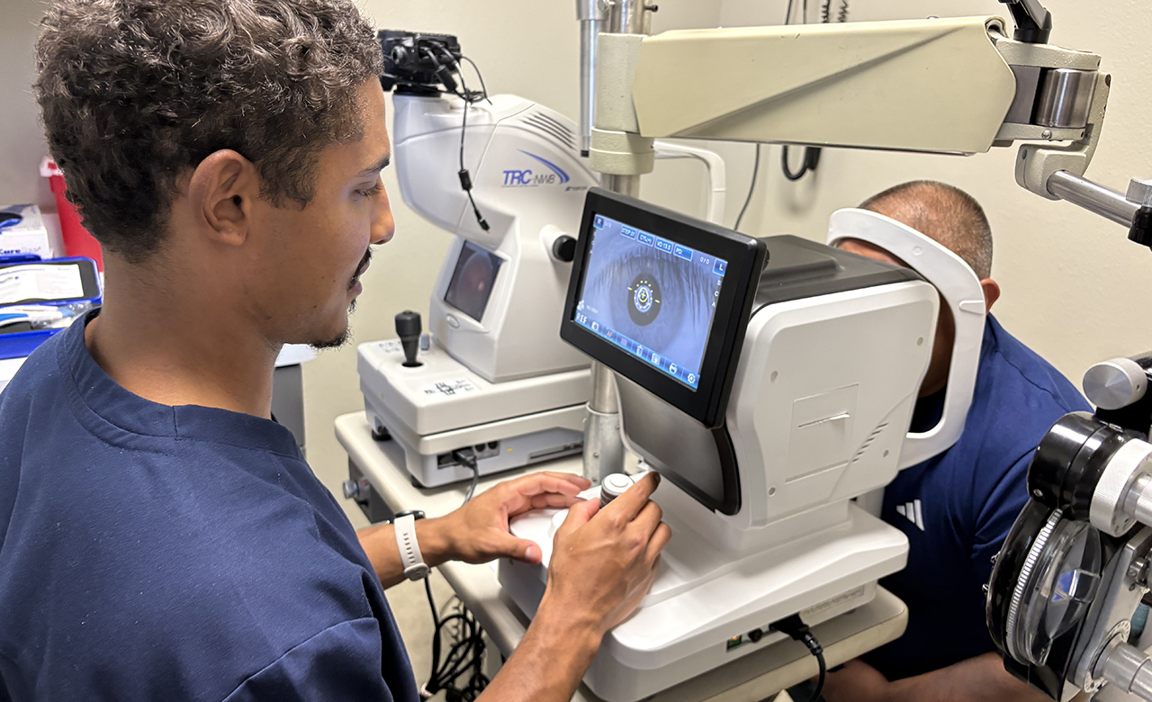 Student performing eye exam