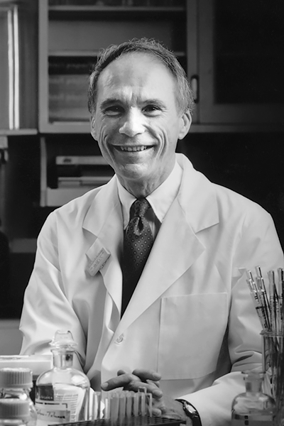 black and white of Dr. Daniel Foster in a laboratory setting