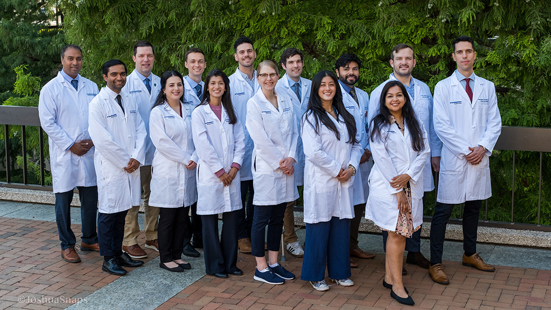 a group of doctors in an outdoor setting 
