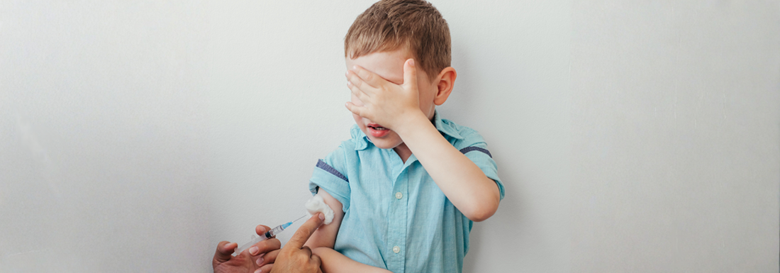 banner, a child receiving a vaccine