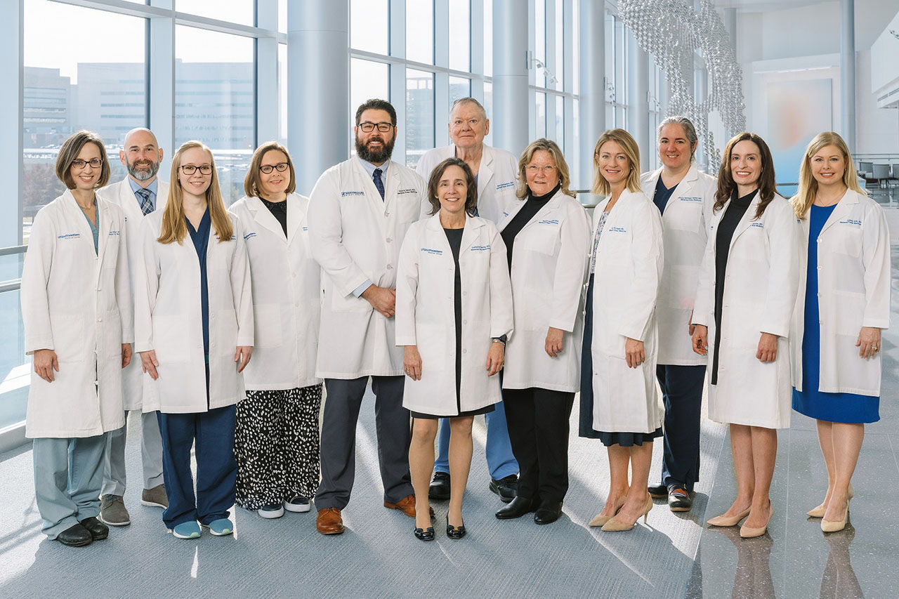 group of physicians in a sunny hallway