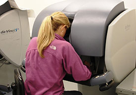 Woman looking into control console