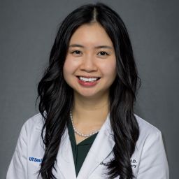 Female Orthopaedic Surgery Resident wearing a white coat