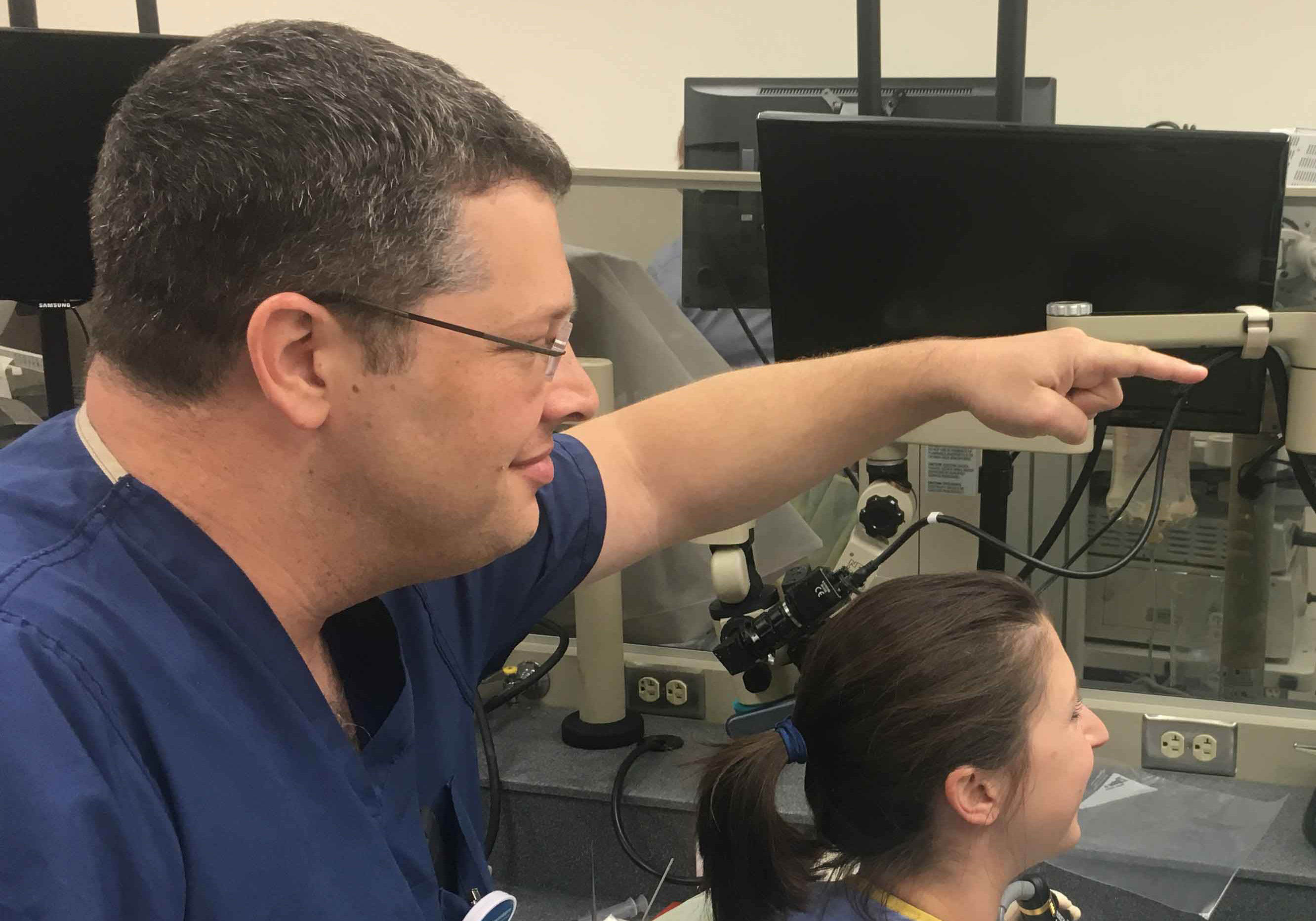 A doctor demostrating medical equipment