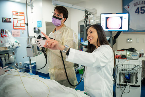 Pair of Doctors completing a procedures A pair of doctors completing a procedure