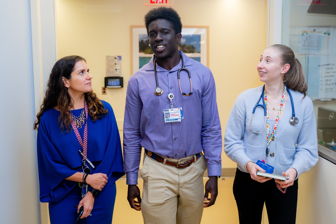 Dr. Watt walking down the hall, interacting with residents