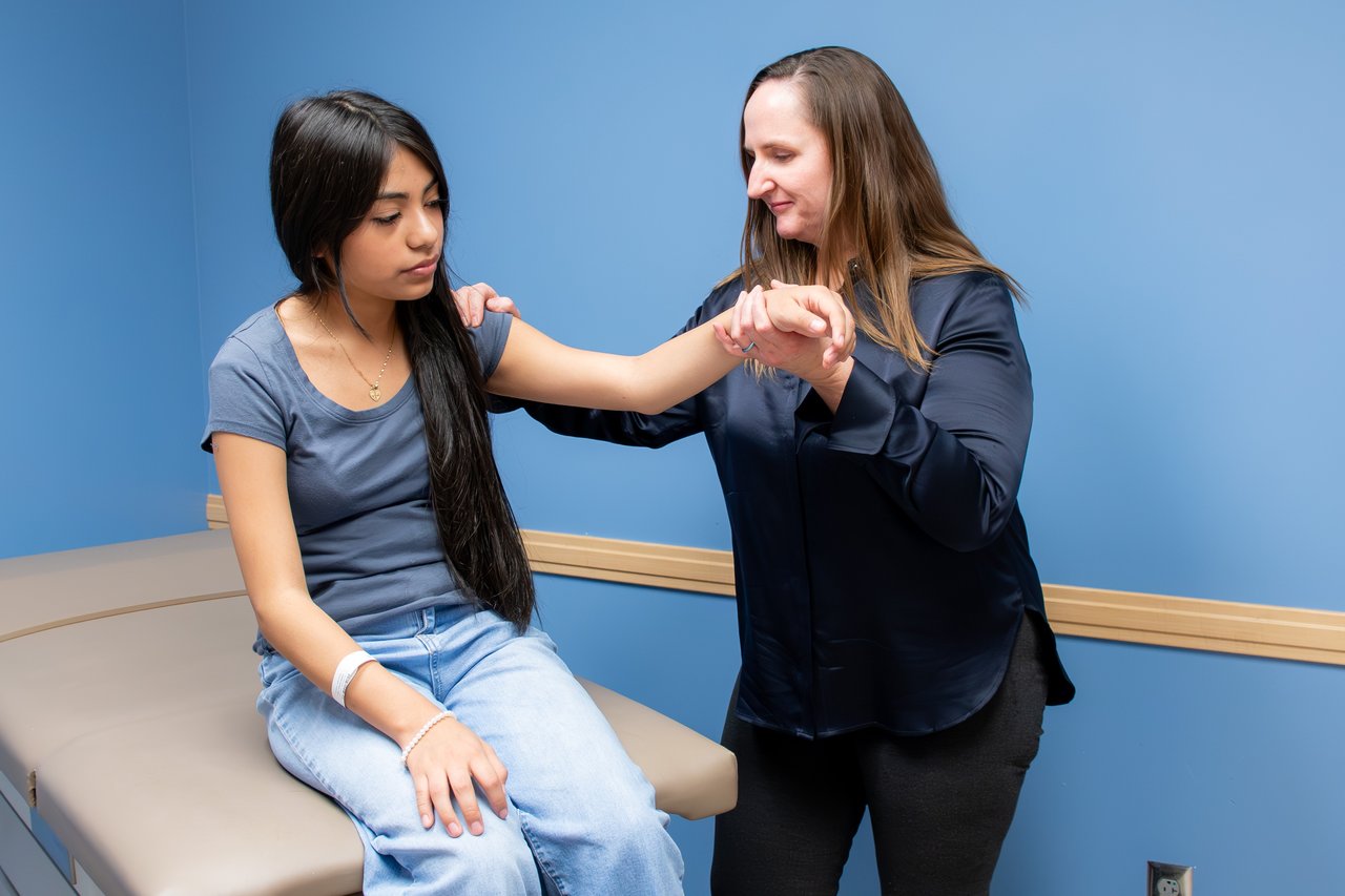 Dr. Nassi doing a check up on a patient