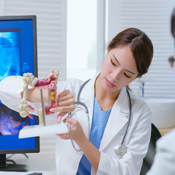physician with colon model