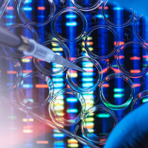 A pipette and a tray in front a colorful background