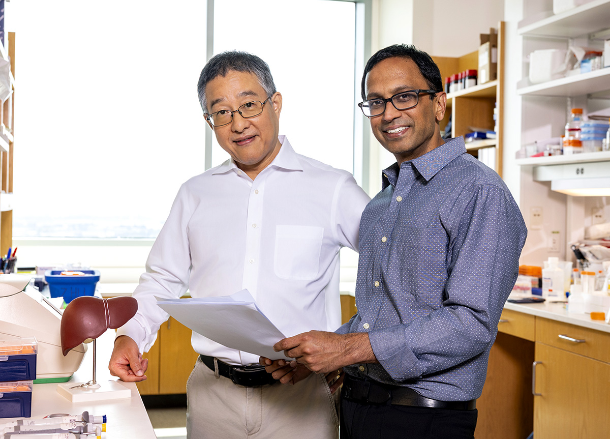 Drs. Singal and Hoshida in a lab