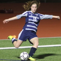 Paige kicks the ball