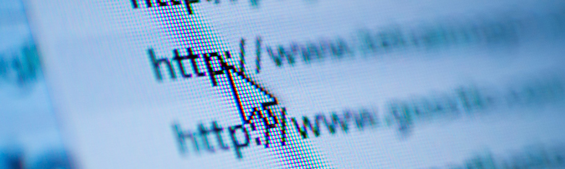 A close-up view of a computer screen, showing a pointer hovering over the http in a web link