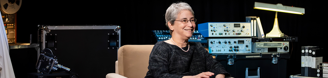 Joan Conaway, Ph.D. smiling while being interviewed