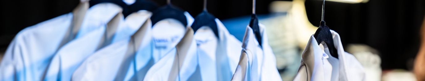 Multiple White Coats hanging up