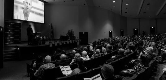 A room full of medical professionals, sitting in an auditorium