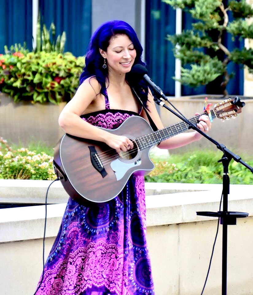 Lindemann Nguyen singing wearing a purple dress