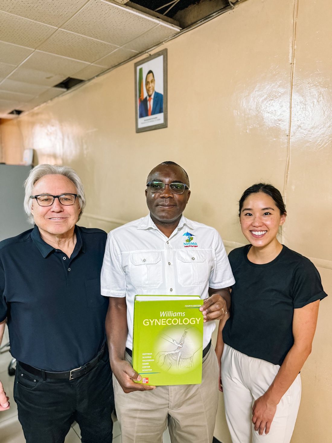 Roger Bedimo, M.D., (center), is Director of UTSW&rsquo;s Office of Global Health. 