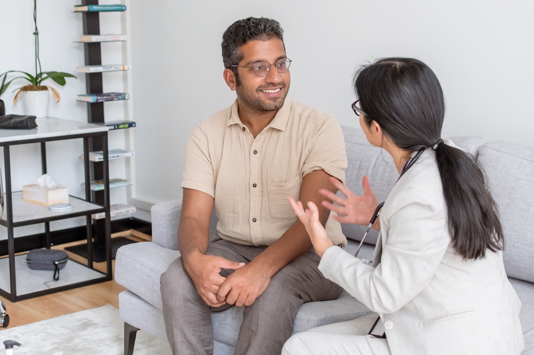 Man meeting with his doctor at home