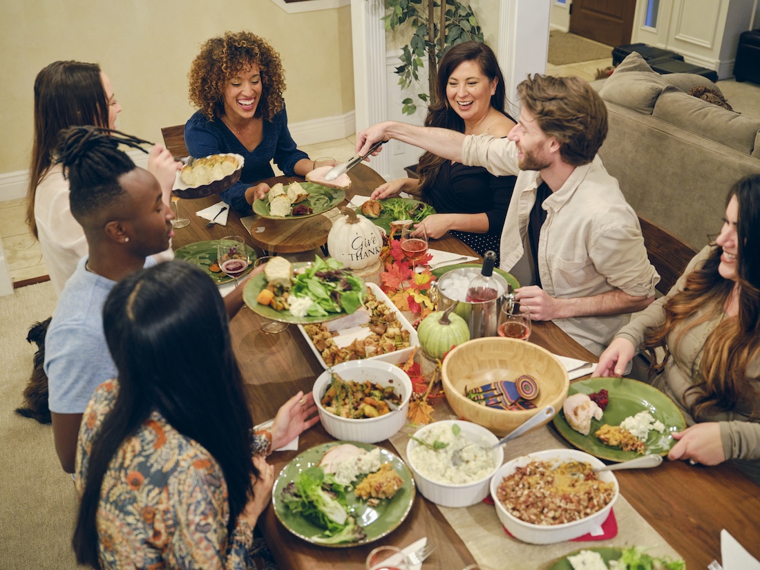 A group of friends celebrating Thanksgiving together with a Friensdsgiving.