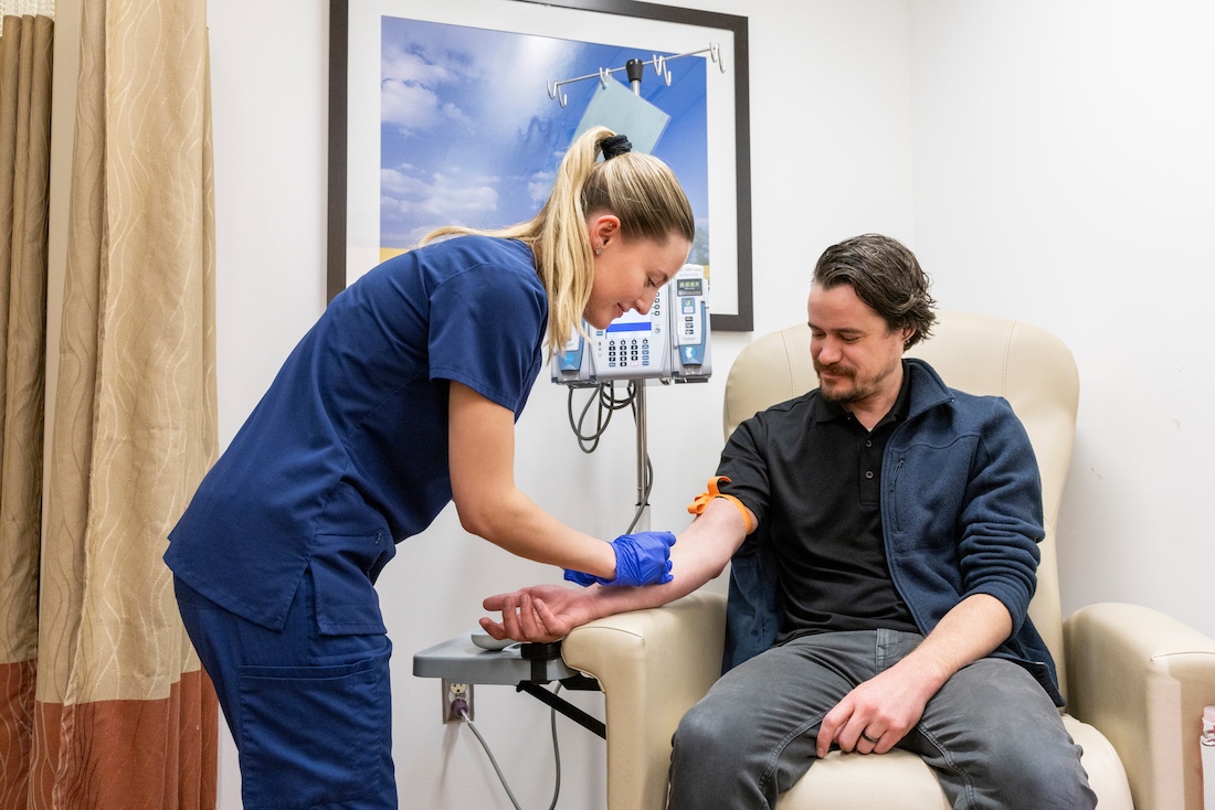 A nurse giving a patient a shot