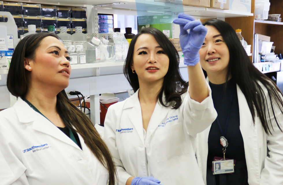 A female medical professionals smiling in the lab